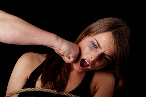 Emotional portrait of abused woman isolated on black   - Foto, Bild