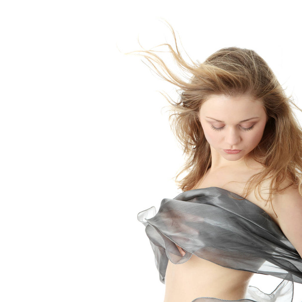 Sensual portrait of young beautiful caucasian woman dancing with wind. Isolated on white  - Φωτογραφία, εικόνα