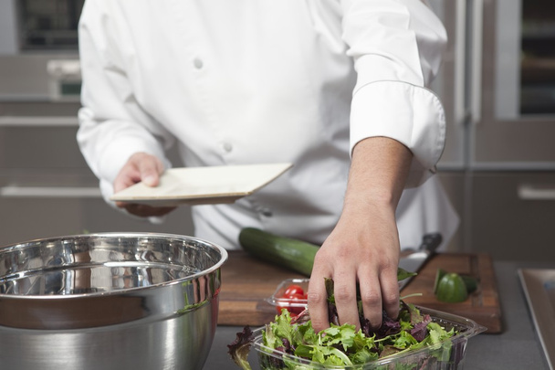 chef preparing salad at kitchen     - Фото, зображення