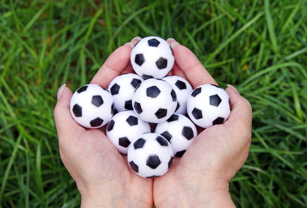 footballs and hands - soccer and hands - 写真・画像