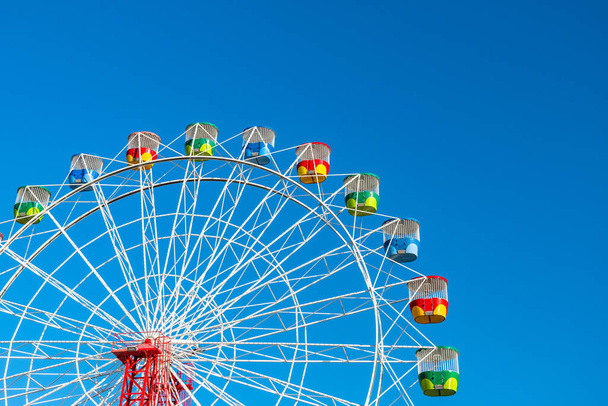 Ferris wheel on clear blue sky background - Photo, Image