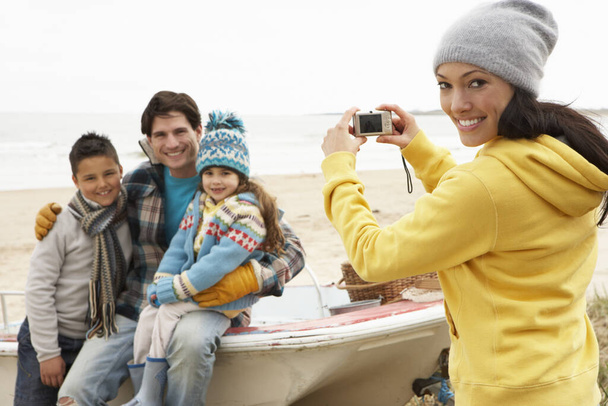Mother Taking Family Photograph On Winter Beach - Fotó, kép