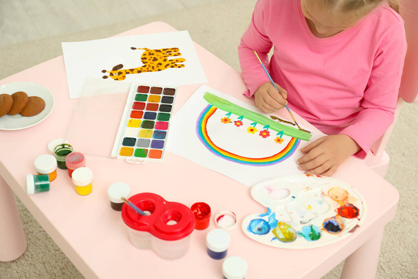 Cute little child painting at table in room - Foto, Imagem