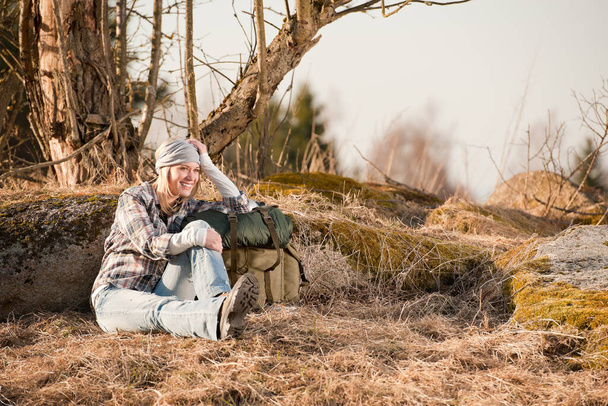 Camping young woman in countryside hiking with backpack relax - Fotó, kép