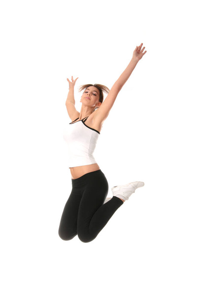 Physical training (aerobics) of beautiful young woman isolated on white background   - Photo, Image