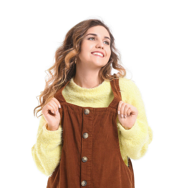 Beautiful young woman in warm sweater on white background - Photo, Image