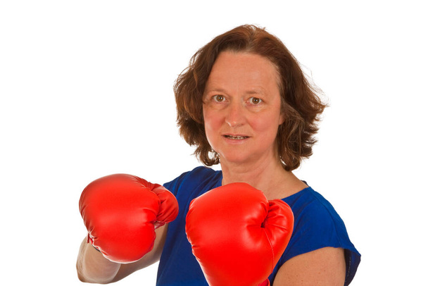middle-aged woman with red boxing gloves on a white background optional - Foto, imagen