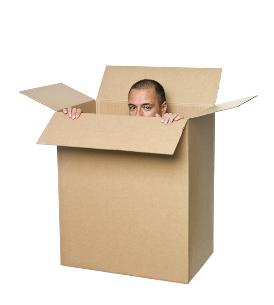 Man in a cardboard box. - Φωτογραφία, εικόνα