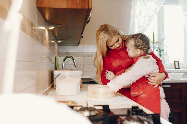 Cute family prepare the breakfest in a kitchen - Photo, image