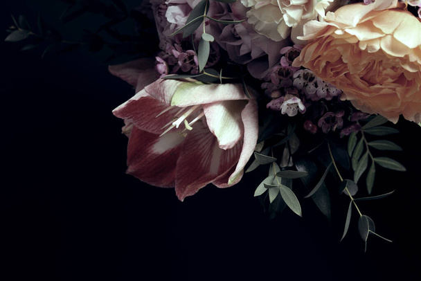 Beautiful bouquet of different flowers on black background. Floral card design with dark vintage effect - Fotografie, Obrázek
