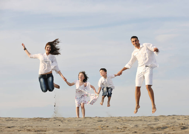 happy young family have fun and live healthy lifestyle on beach - Foto, Bild