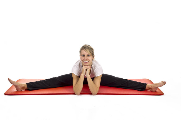 young woman doing yoga exercise isolated on white - Foto, Imagem