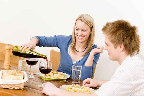 Dinner romantic couple enjoy red wine eat pasta at home - Fotografie, Obrázek