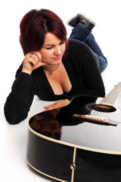 woman lying with guitar - Photo, image