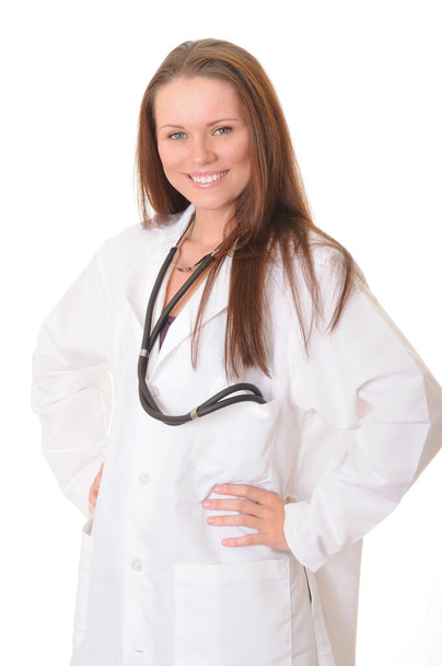 Young female doctor or nurse wearing a stethoscope - Фото, зображення