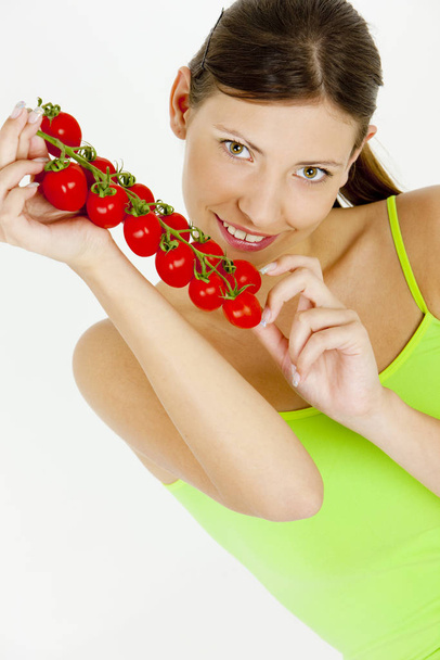 portrait of woman holding tomatoes - Foto, afbeelding