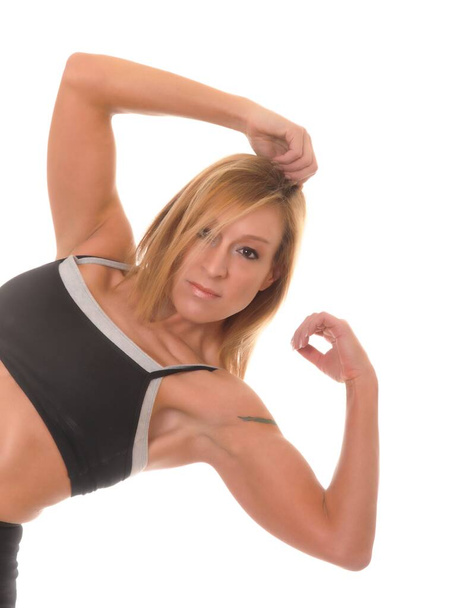 Beautiful young blond lady doing a fitness workout  - Fotó, kép