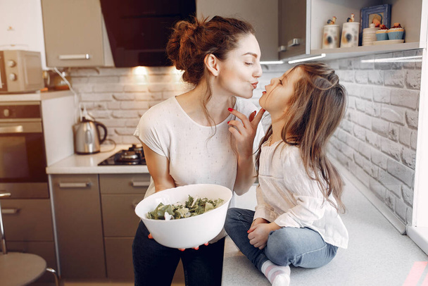 Mother with cute daughter at home - Foto, imagen