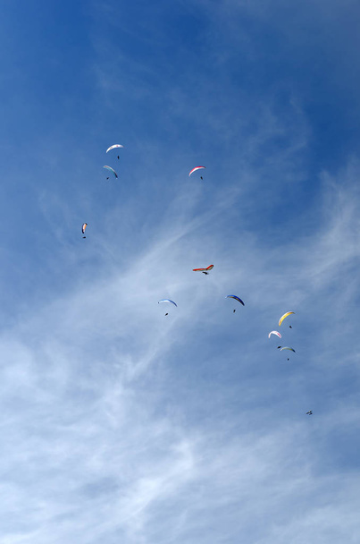 Paragliding is the recreational and competitive adventure sport  - Фото, изображение