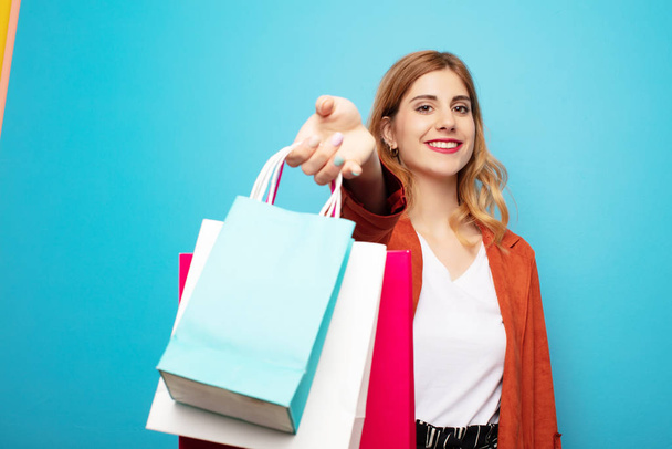 young pretty blonde woman with shopping bags - Fotoğraf, Görsel
