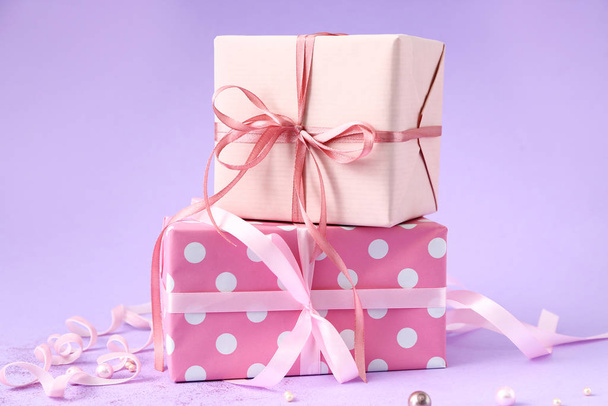 Packed gifts on color background - Фото, изображение