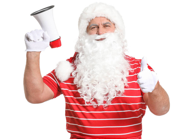 Święty Mikołaj z megafonem pokazującym kciuk do góry na białym tle. Pojęcie urlopu - Zdjęcie, obraz