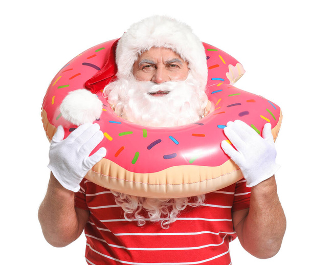 Papai Noel com anel de natação no fundo branco. Conceito de férias
 - Foto, Imagem