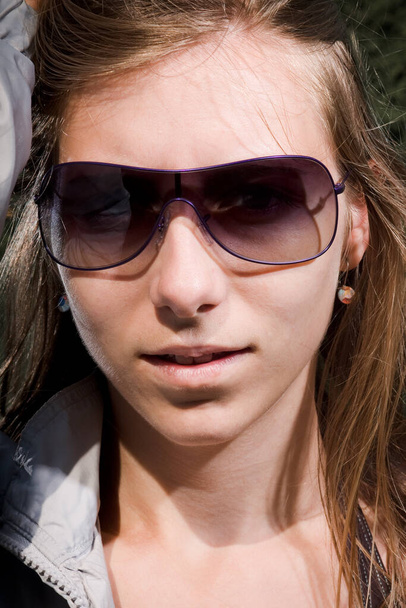 pretty woman with sunglasses and long hair - 写真・画像