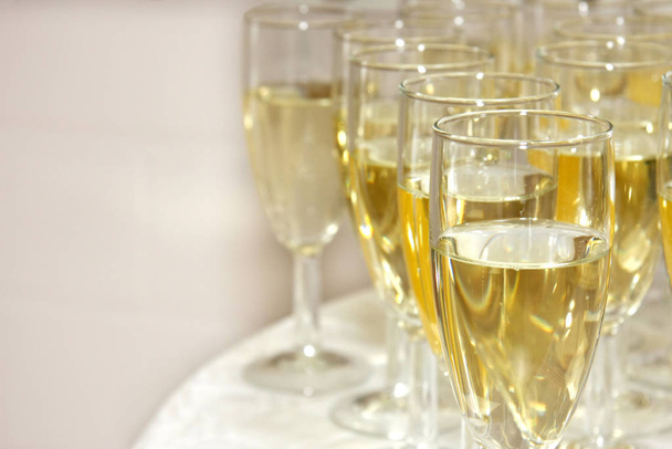 closeup of filled champagne glasses on table with copy space - Fotografie, Obrázek