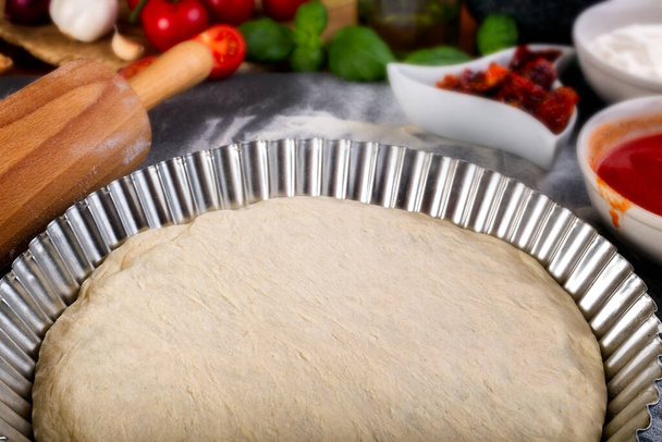 Prepering pizza dough for baking - Photo, Image