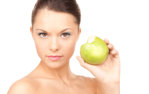 Young beautiful woman with green apple - Photo, image