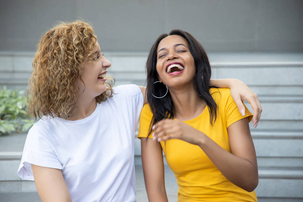 happy woman with different skin color friend spending good time together; concept of ethnicity and skin color difference tolerance, love and peace, friendship, social diversity - Foto, afbeelding