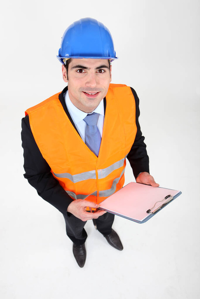 businessman taking notes on a construction site - Foto, Imagen