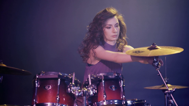 attractive drummer touching drum set  - Кадри, відео