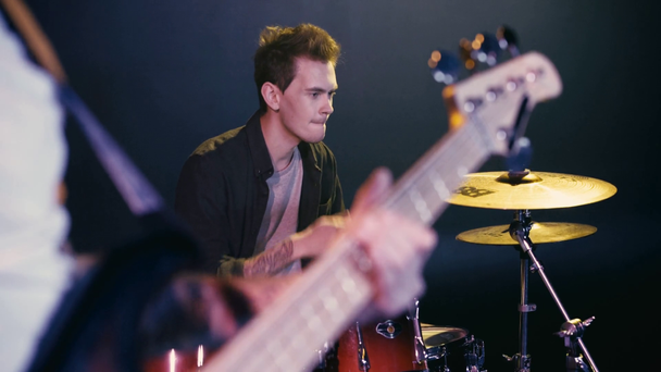 selective focus of drummer performing with guitarist - Footage, Video