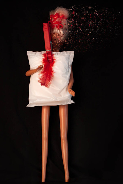 Womans headache during menstruation. Irregular heavy period concept. Doll body with menstrual pad, creative minimalism - Photo, Image