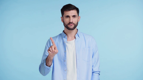displeased man showing no gesture isolated on blue  - Filmagem, Vídeo
