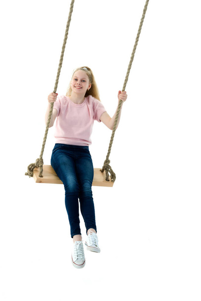 Beautiful teen school girl swinging on a swing. Concept summer v - Fotoğraf, Görsel