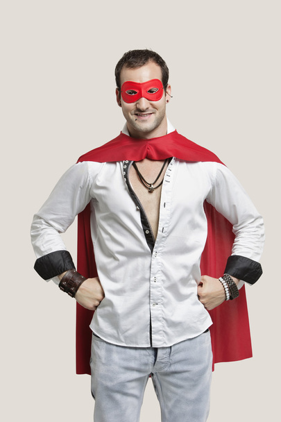 Young man in superhero costume - Foto, afbeelding