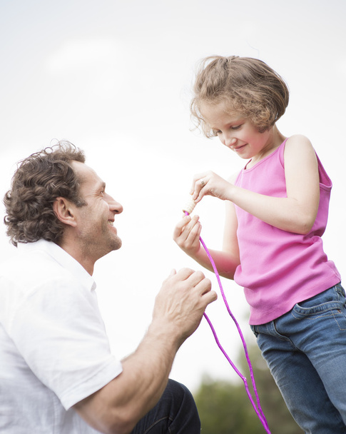 Father and daughter with skipping rope - Foto, Bild