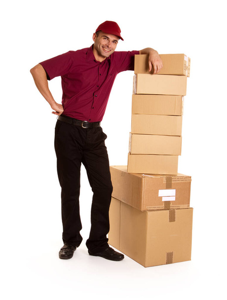 delivery man carrying boxes isolated on white background - Foto, Bild