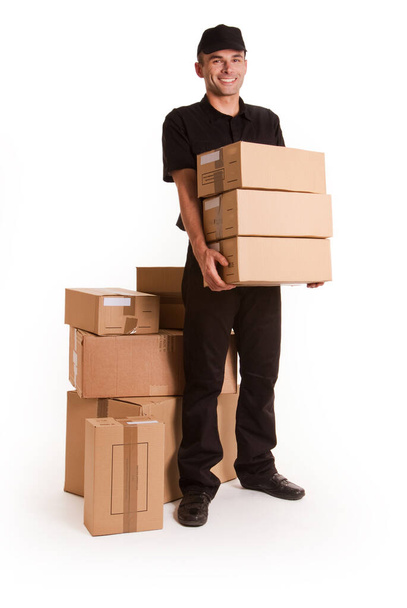 man with a cardboard box on a white background - Valokuva, kuva