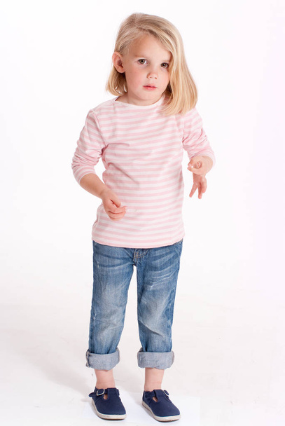  little adorable girl in stylish clothe, posing on camera - Photo, image