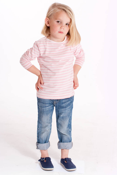 little adorable girl in stylish clothe, posing on camera - Foto, afbeelding