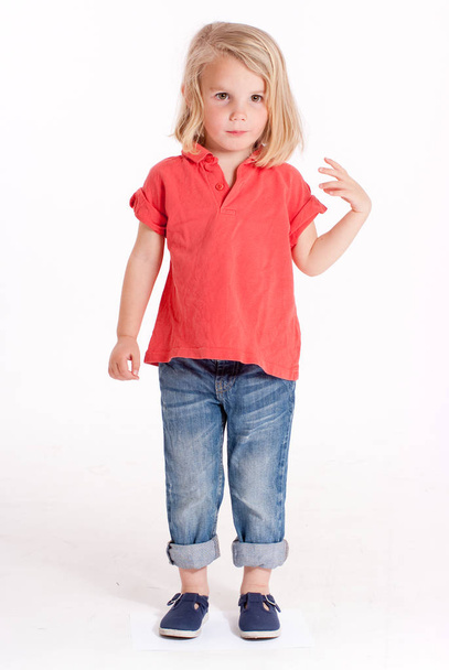  little adorable girl in stylish clothe, posing on camera - 写真・画像