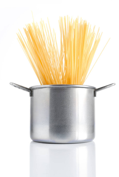 group of spaghetti inside a pot isolated on white background - Photo, Image
