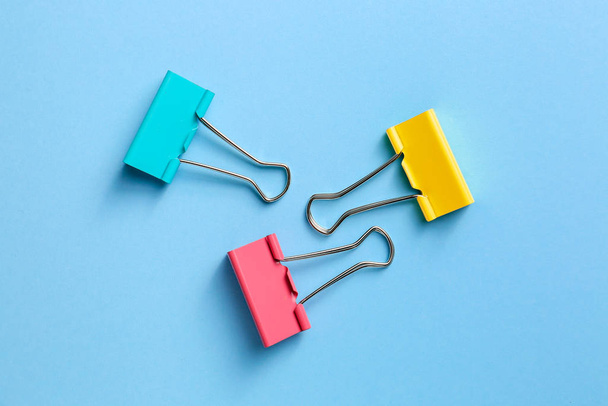 Binder clips for paper on color background - Photo, Image