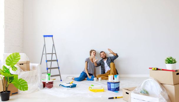 young happy family married couple dreams of renovating  house an - Photo, Image