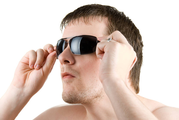 young man portrait with sunglasses on white - Fotó, kép