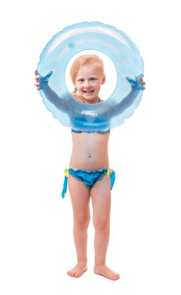 Happy baby girl in swimsuit with circle isolated on white - Foto, immagini